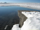 A view of snow and ice covered Las Animas Lake on the Mondaca Trail from Radal Siete Tazas, Chile.
